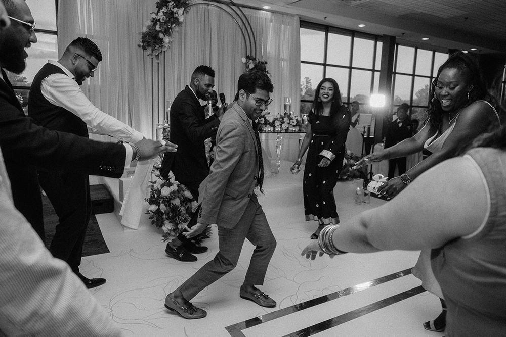 Indian dancer shows off his steps during Indian wedding reception