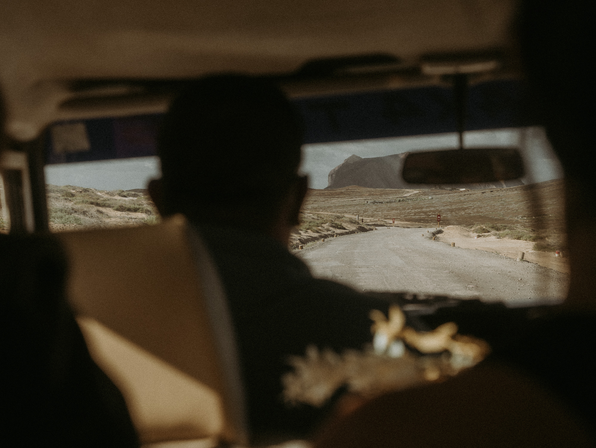 Driver navigates on dirt road on La Graciosa towards Las Conchas beach. 