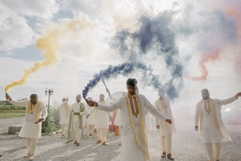 Colourful smoke bombs during traditional Indian wedding ceremony