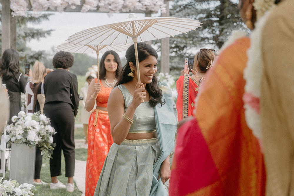 Guests arrive dressed in traditional Indian wedding attire