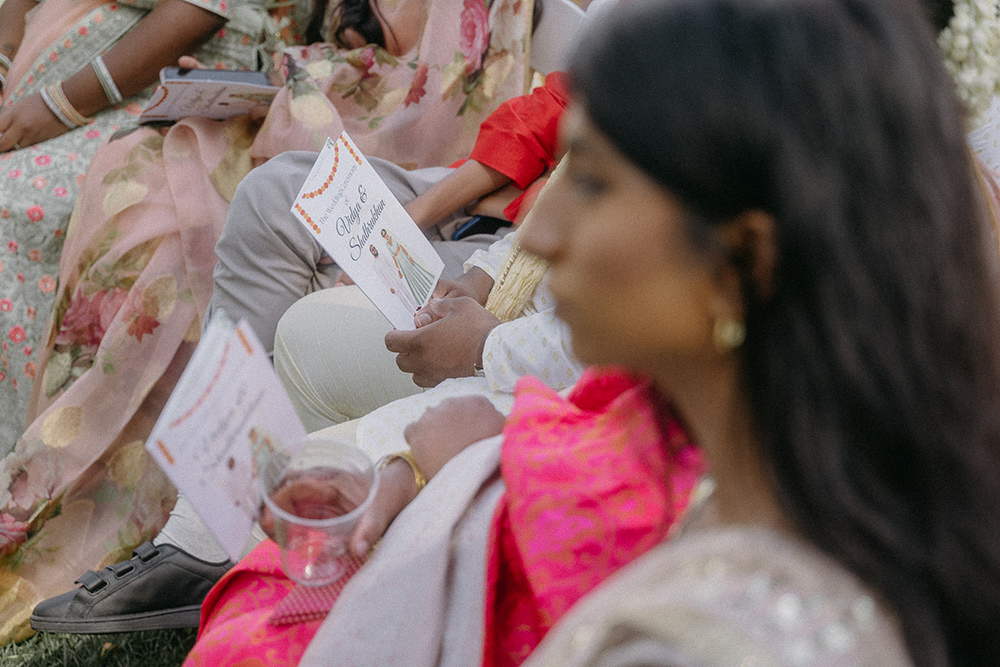 Guests sit during traditional Indian wedding ceremony