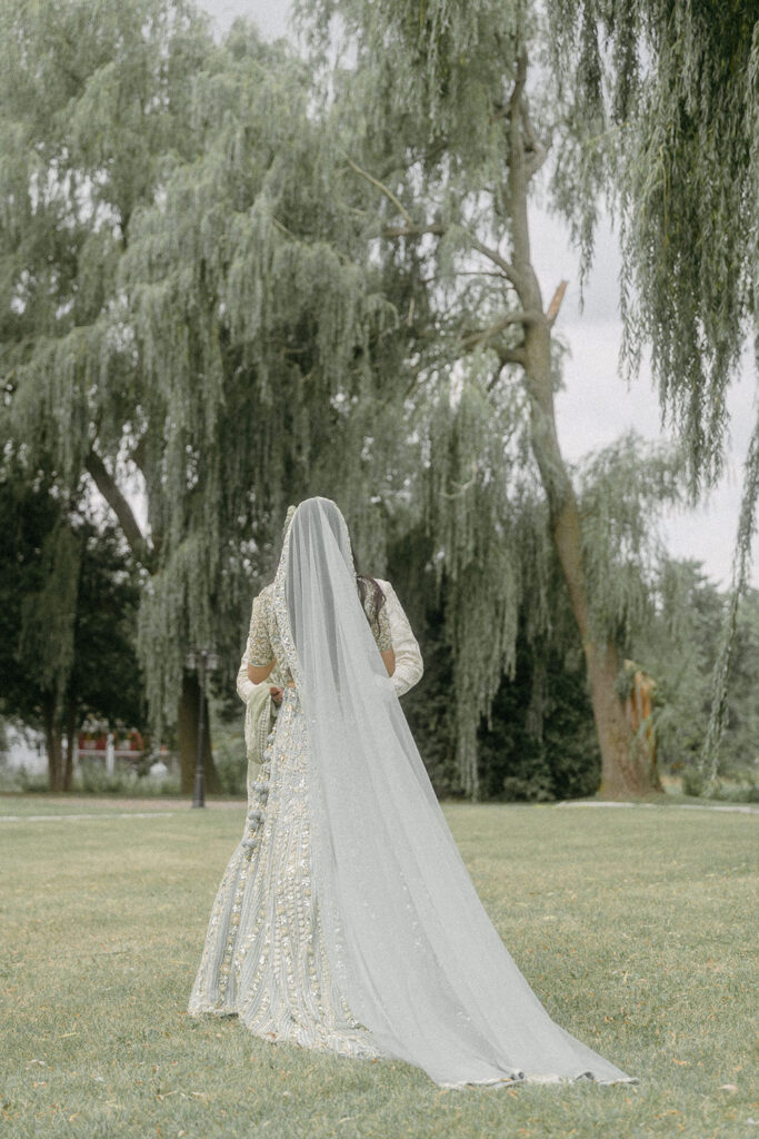 Bride walks in traditional Indian wedding dress